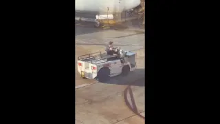 Wild video shows man driving stolen airport tug dangerously close to parked plane