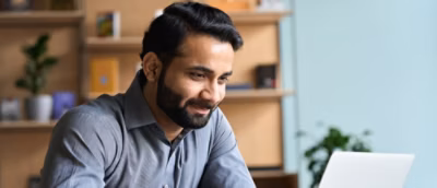 A close-up of a man's face with a beard.
