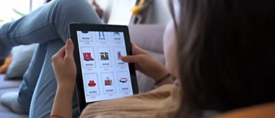 A woman holding a tablet.