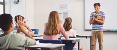 A group of students sitting at desks.