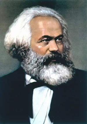 Portrait of German philosopher Karl Marx with a full white beard and hair, wearing a dark suit and white shirt, looking to the side.