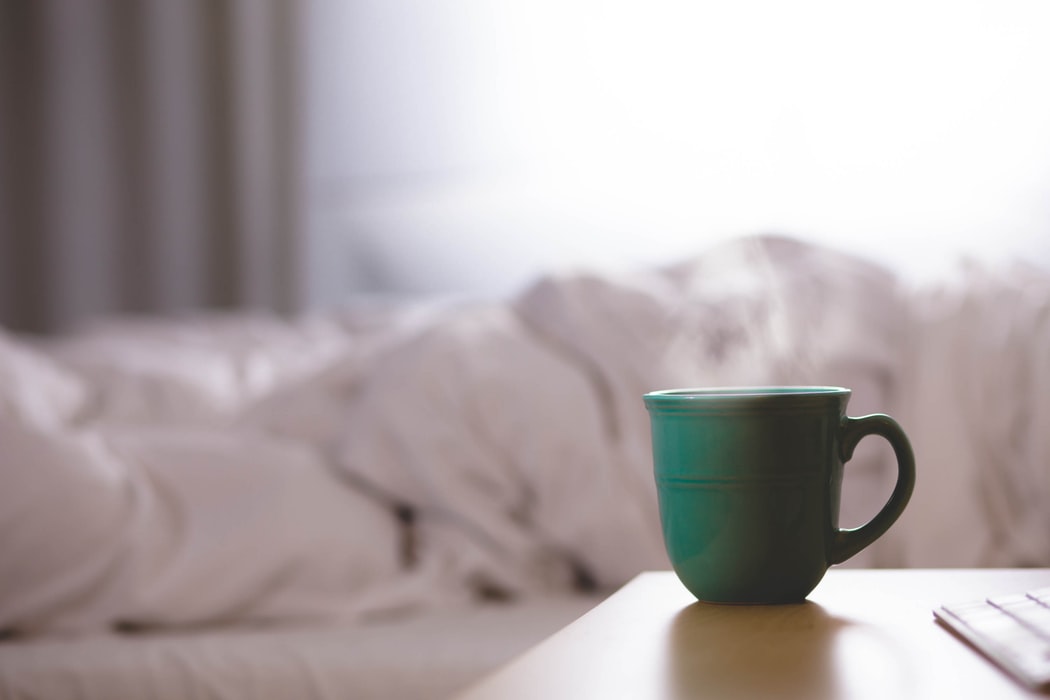 ceramic coffee mug with steam rising on desk ceramic coffee mug with steam rising on desk
