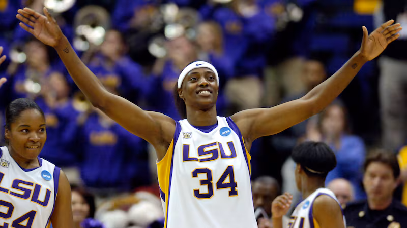 LSU center Sylvia Fowles (34) and teammate guard Marian Whitfield, left, celebrate after an...