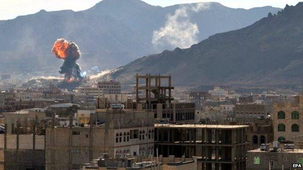 Fireball rises into sky above Sanaa during clashes between Houthi rebels and soldiers (19 January 2015)