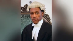 Jordan Wike wear im lawyer regalia and pose for foto