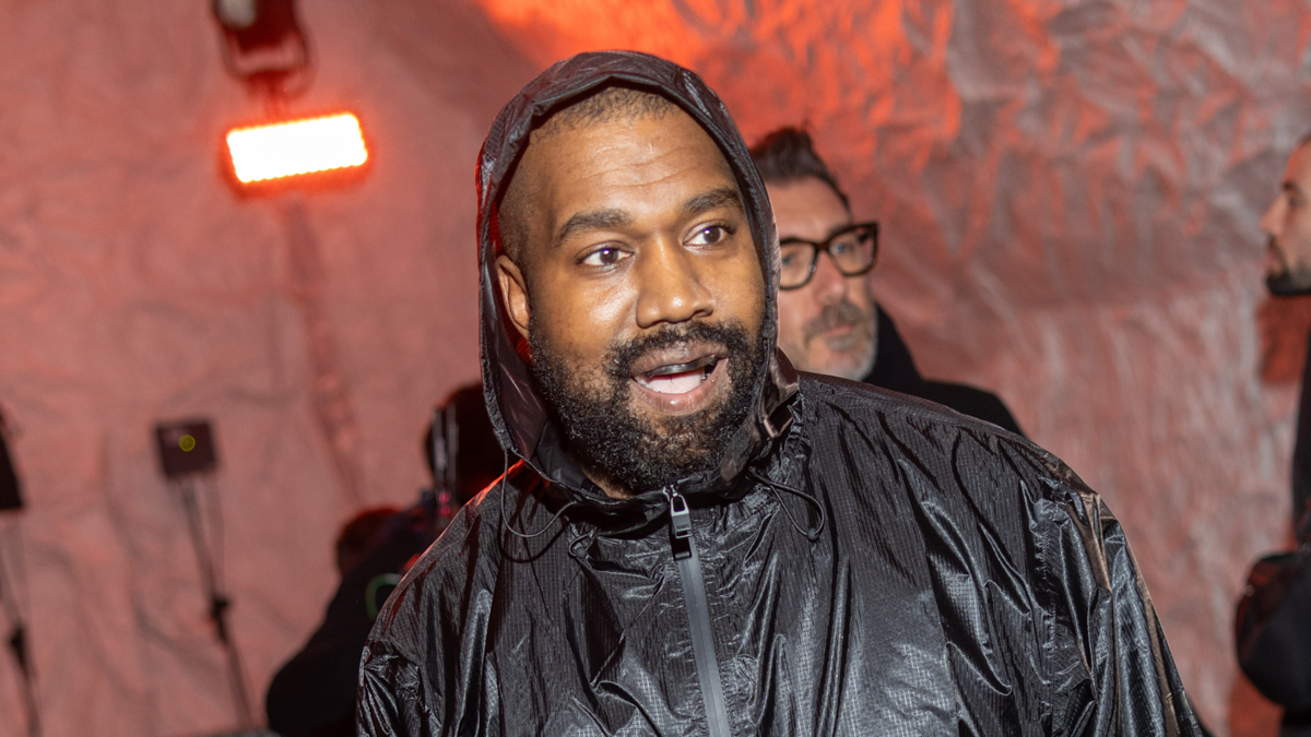 Person in hooded jacket at an event. (Image does not include Kim Kardashian or Elsa from Frozen)