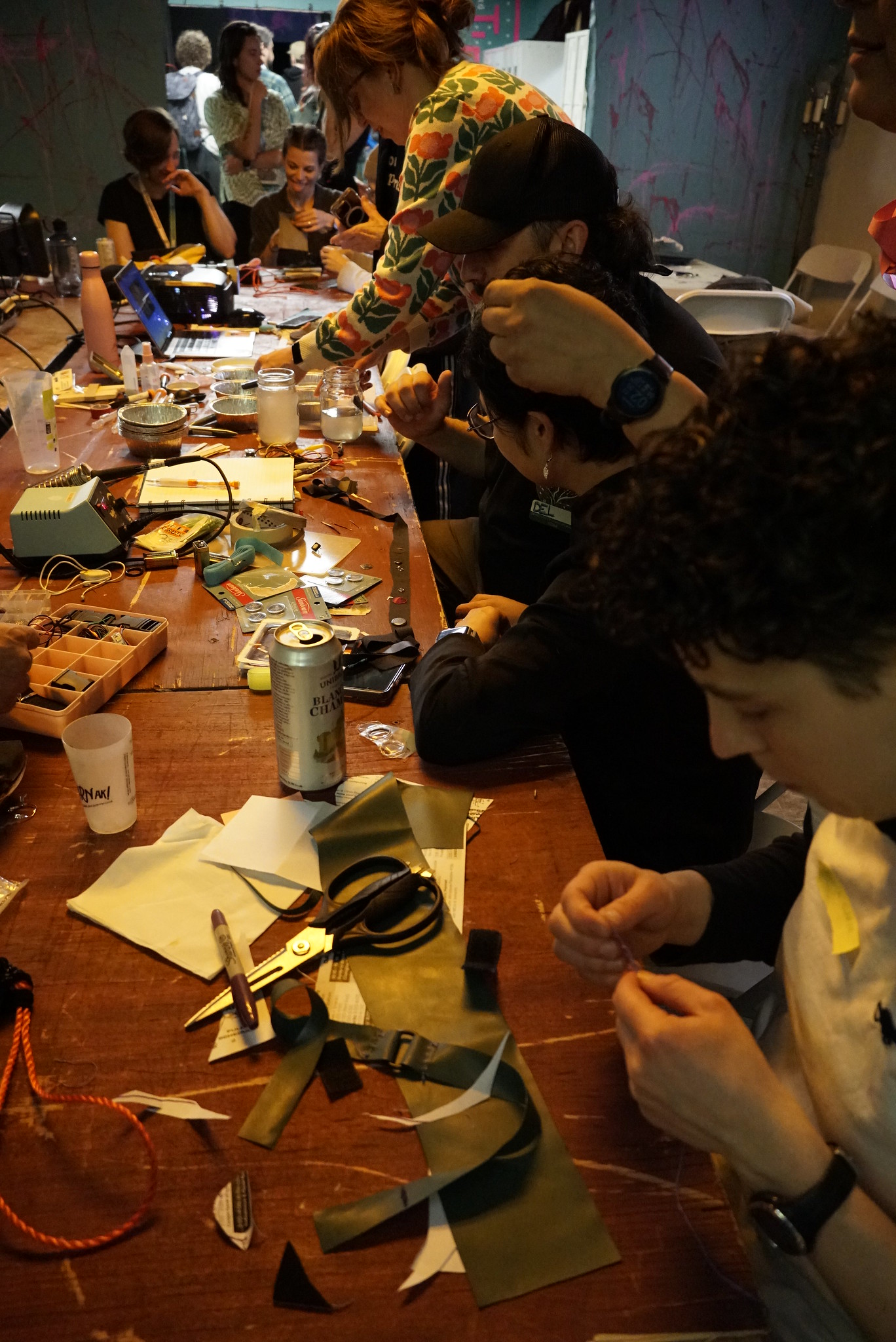 A photo showing attendees crafting at the Open Hardware Summit 2024.