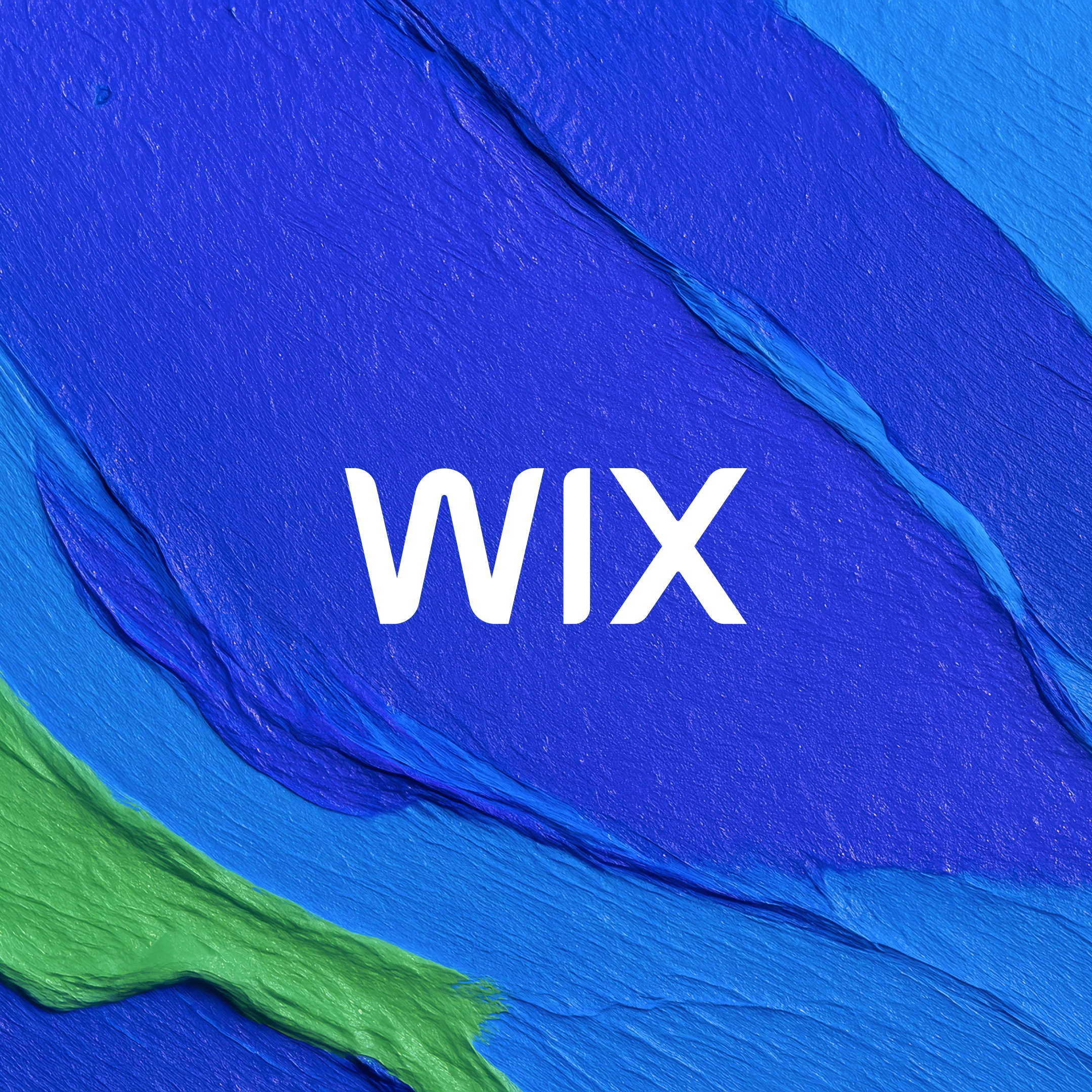 White Wix logo on a background of blue and green paint swathes
