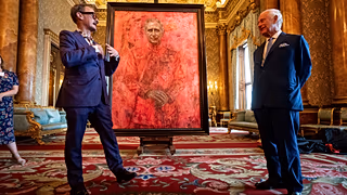 Artist Jonathan Yeo, left, and Britain's King Charles III at the unveiling of Yeo's portrait of the King, in the blue drawing room at Buckingham Palace.