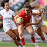 Canada's Taylor Perry breaks through a tackle during the 2025 Women's Rugby World Cup final against England at Allianz Arena in London. The two teams will square off in a high-stakes double-header in Toronto and Ottawa in October.