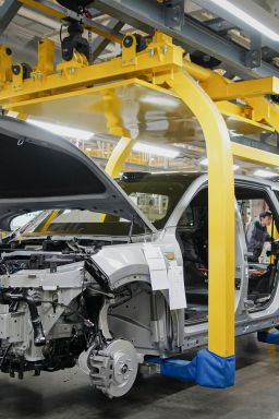 This photo taken on March 27, 2024 shows employees working on a car assembly line at a factory of Chinese carmaker Li Auto in Changzhou, in eastern China's Jiangsu province.