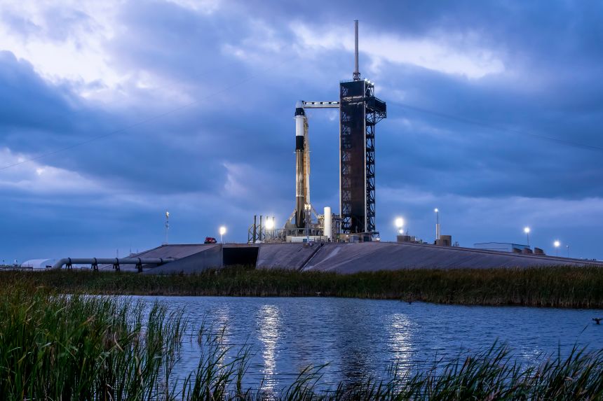 A SpaceX Falcon 9 rocket and Dragon capsule sit on a launchpad in Florida ahead of Monday's Fram2 mission launch attempt.