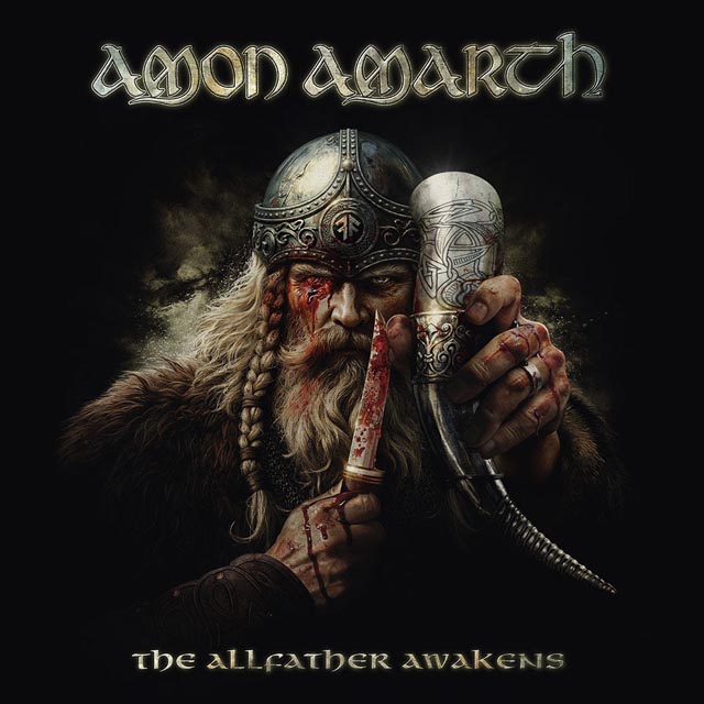 Album cover for Amon Amarth: a bloodied Viking with braided beard and a horned helmet holding a dagger to his lips against a dark background, with 'The Allfather Awakens' title above.