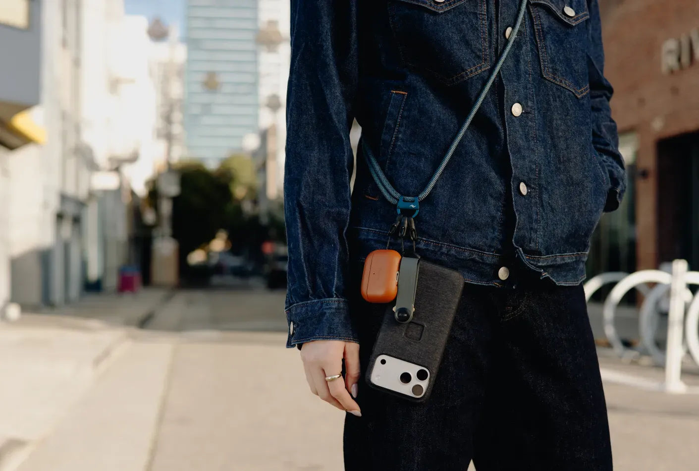 A word with a woman who’s trying to pull off a crossbody phone strap