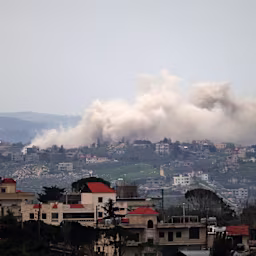 Smoke rises from explosions during Israeli military operations in the Lebanese village of Taybeh on April 1, 2026. Lebanon was drawn into the Middle East war on March 2 when Tehran-backed militant group Hezbollah launched attacks on Israel to avenge the killing of Iran’s leader Ayatollah Ali Khamenei. Israel has responded with broad strikes across Lebanon and a ground offensive. | Credit: AFP via Getty Images