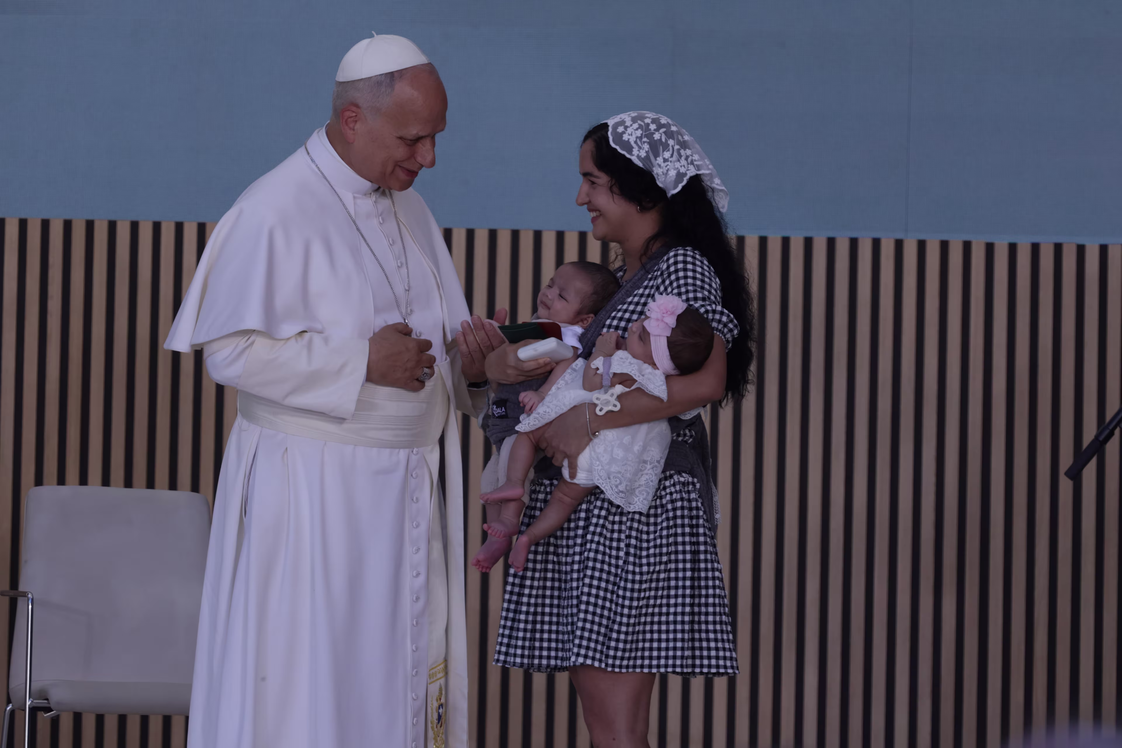 Pope Leo XIV meets a woman from Cuba and her twin babies during an encounter with staff and beneficiaries, including migrants, of the CEDIA 24 Horas center, part of the Caritas of the Archdiocese of Madrid in Spain on June 6, 2026. | Credit: Daniel Ibañez/EWTN News