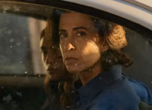 Fernanda Torres as Eunice Paiva inside a car in I'm Still Here