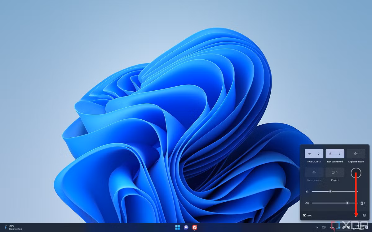 Image showing how swiping down on an empty area of the Quick Settings panel closes it