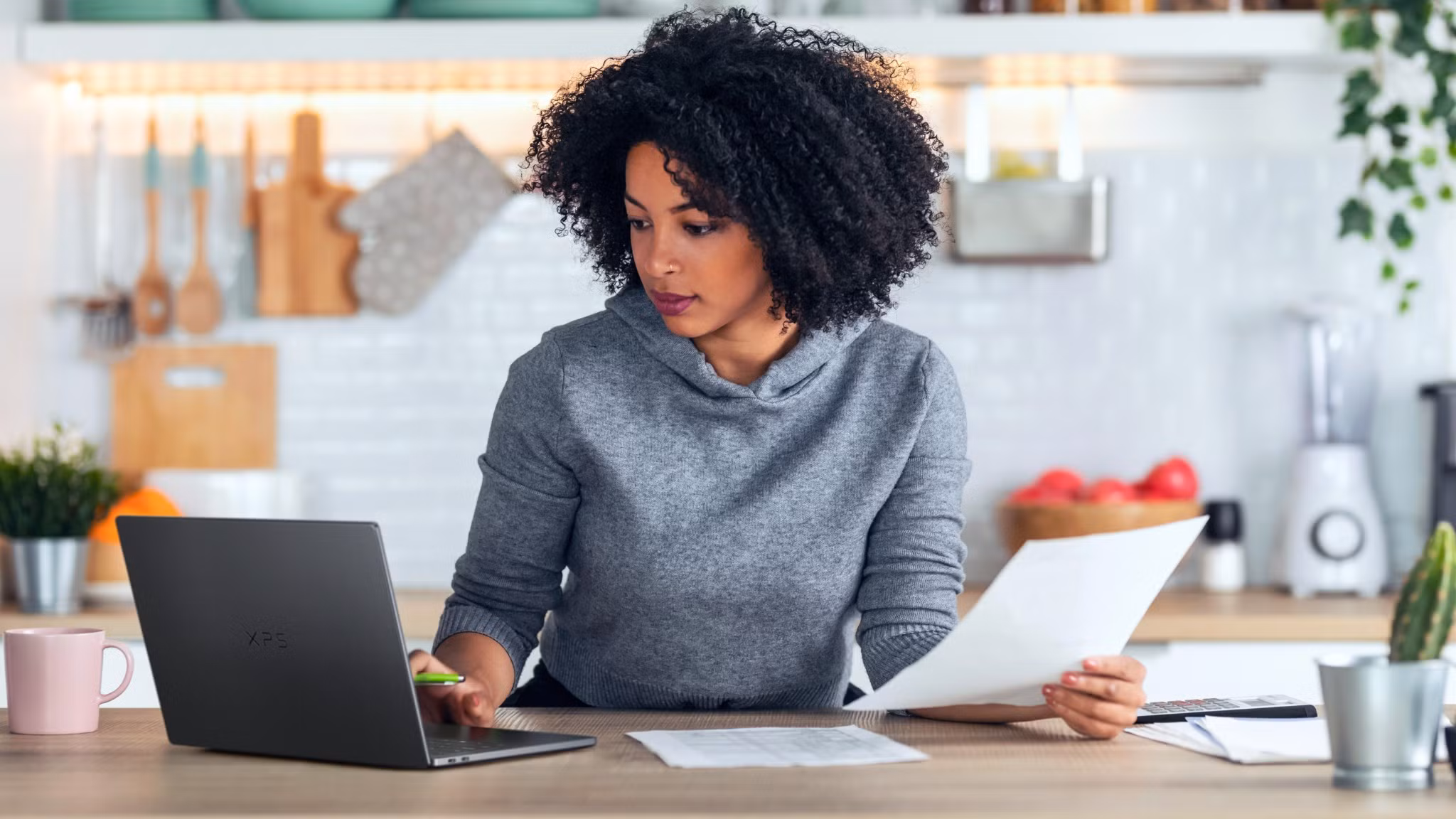 Woman using a Dell XPS laptop