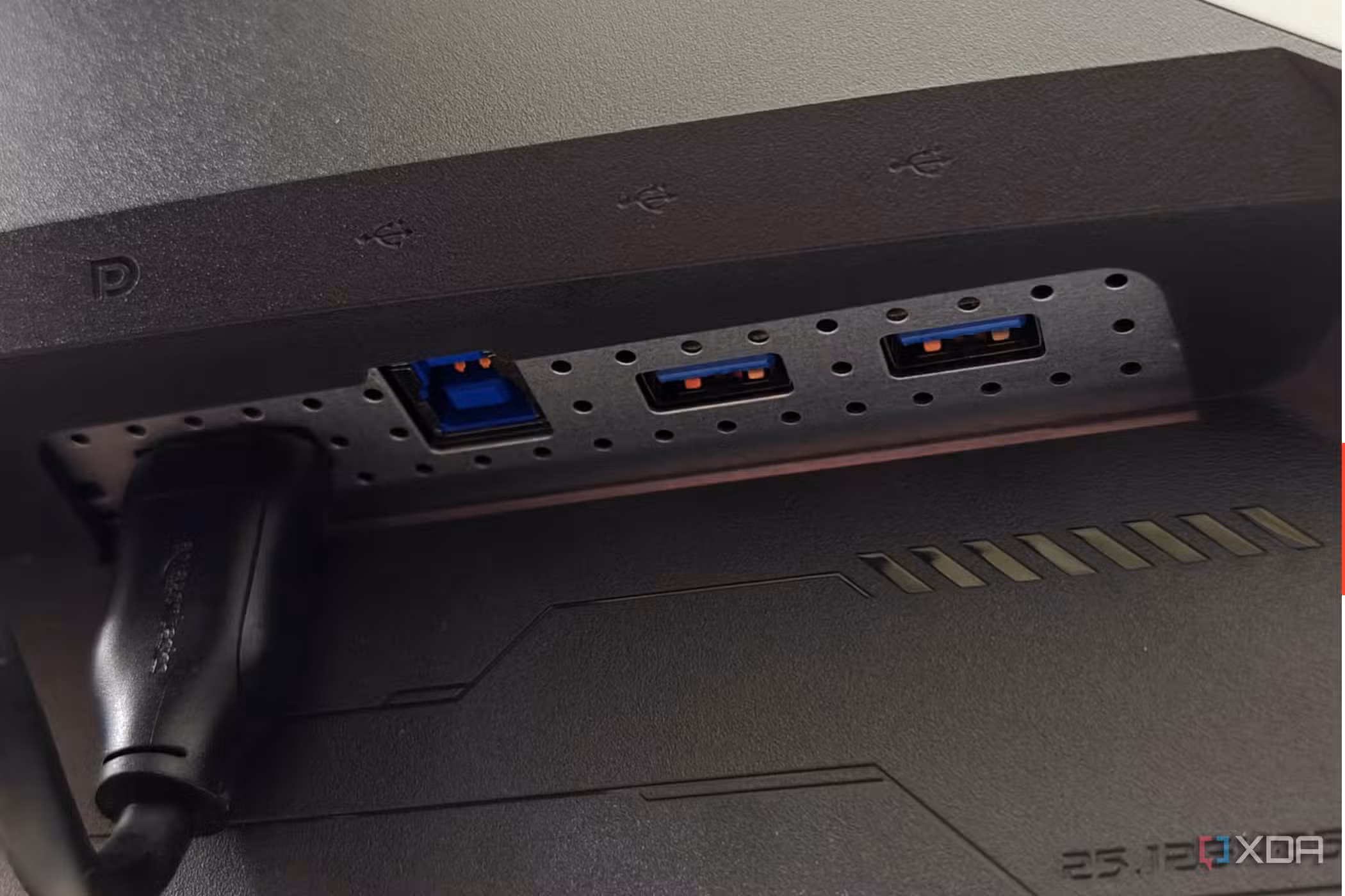 An image showing the right side ports of the Asus ROG PG27AQDM monitor.