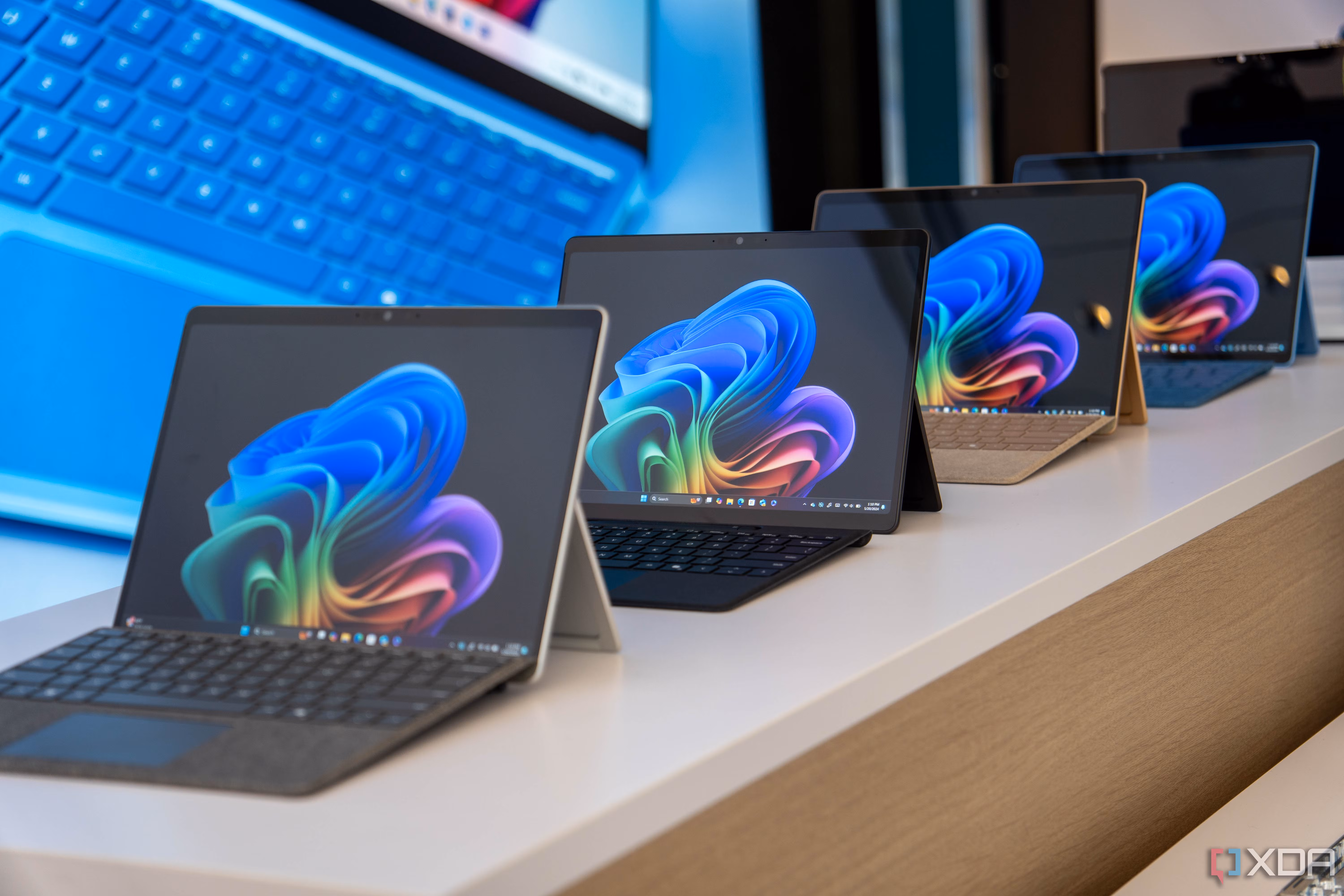 Surface Pro 11 devices on display at a Microsoft event