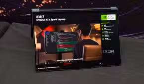 RTX Spark laptop in tent mode with a slide reading The chips and the OS must evolve