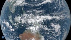 Satellite view of the Indonesian archipelago largely covered by dense clouds.