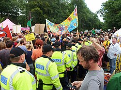 Protestors flanked by police march in Balcombe
