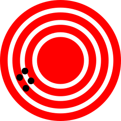 Four small dots on a large bullseye