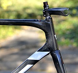 Nude carbon on a Time road bicycle showing different fiber orientations