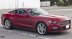 Front three-quarters view of a red coupe