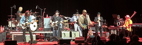 The Mavericks performing on a stage.