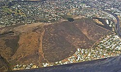 Aerial view of Tygerberg Nature Reserve in the southernmost Tierberg. The Plattekloof and Welgemoed (above) suburbs flank the mountain, while the N1 highway skirts its southern limit.