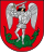 A coat of arms depicting an angel in full body armour and wings outspread while standing on a green dragon with a twisted tail