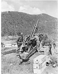Crew of M101 105 mm howitzer in action along the 1st Cavalry Division sector of the Korean battle front.