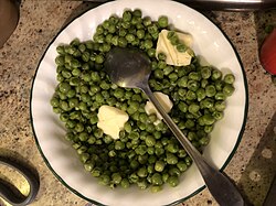Steamed peas with butter