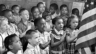 Children saying the pledge of allegiance at Gwynns Falls Elementary School, Maryland, 1 year after Brown v. Board of Education.