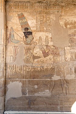 A relief showing Darius I offering lettuces to the Egyptian deity Amun-Ra Kamutef, Temple of Hibis