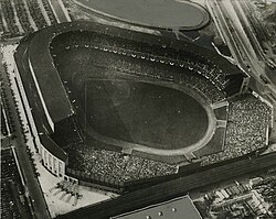Black and white aerial view of Old Yankee Stadium, looking towards home plate from the outfield.