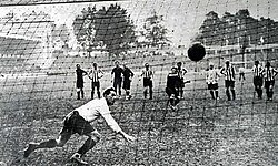 A successful penalty kick, seen from the back of the net