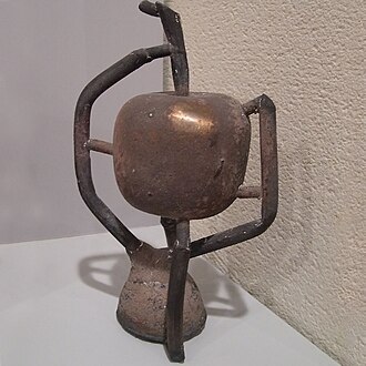 Step 6: The bronze cast, still with spruing attached. The sprue will be cut away and the final shape polished.