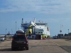 Large roll-on roll-off ferry carrying passengers and vehicles across open water