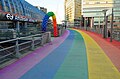 Rainbow footpath at a train station in Amsterdam. 2026.