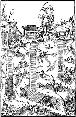 Woodcut of a mine with three shafts