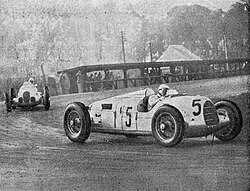 Bernd Rosemeyer driving the Auto Union Type C ahead of Manfred von Brauchitsch at the 1937 Donington Grand Prix