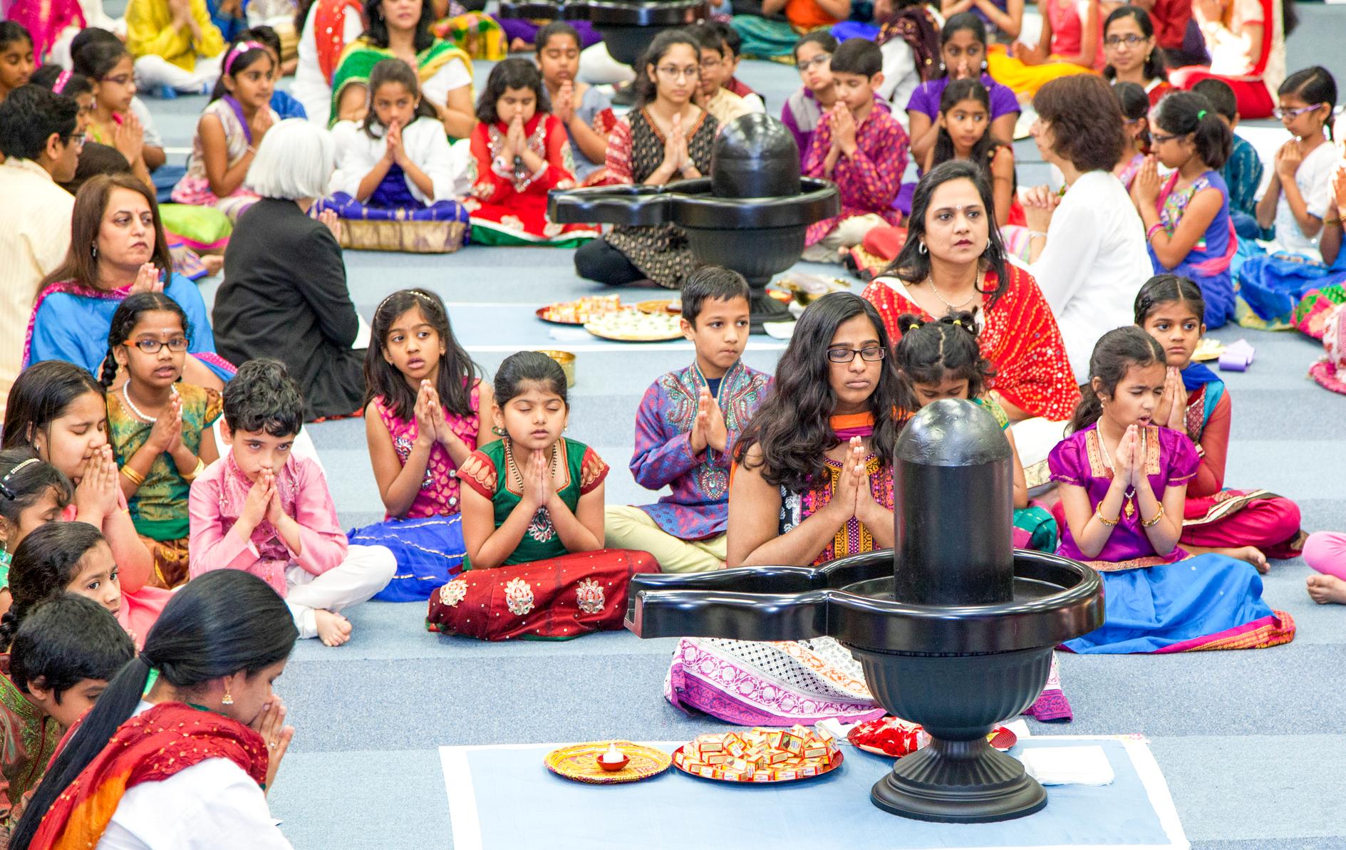 Devotional: Bala Vihar children chant and perform prayers to Sivalingams in Houston, Texas, one of the largest Chinmaya Mission centers in North America